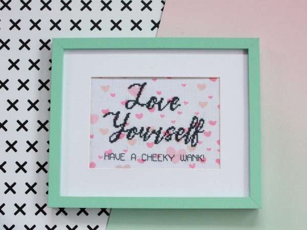 Funny cross stitch that says love yourself, have a cheeky wank
