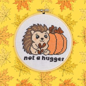 Funny hedgehog cross stitch design with pumpkin, from Curious Twist’s Sweet and Salty Collection.