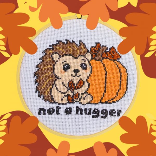Funny hedgehog cross stitch with pumpkin, autumn theme.